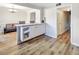 Kitchen and dining area featuring modern wood floors, bright lighting and neutral walls at 6520 Roswell Rd # 59, Atlanta, GA 30328