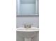 Close up of a pedestal sink and mirror in a half bathroom at 6214 Ripple Way # 91, South Fulton, GA 30349
