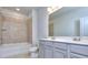 Bathroom with double vanity, granite countertop, toilet, and shower/tub combo at 6214 Ripple Way # 91, South Fulton, GA 30349
