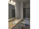 Bathroom with granite countertop vanity, mirror, toilet, and shower/tub combo at 6214 Ripple Way # 91, South Fulton, GA 30349