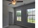 Bright bedroom with natural light from two windows and gray paint at 6214 Ripple Way # 91, South Fulton, GA 30349
