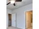 Bedroom with carpeted floors, grey walls, and two doors at 6214 Ripple Way # 91, South Fulton, GA 30349