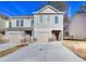 Charming townhome with a one-car garage and long driveway, complemented by a well-maintained lawn at 6214 Ripple Way # 91, South Fulton, GA 30349