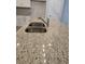 Close up of the kitchen island featuring granite countertops and a stainless steel double sink at 6214 Ripple Way # 91, South Fulton, GA 30349