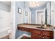 Clean bathroom with a vanity, mirror, and shower/tub combo at 2037 Hatteras Way, Atlanta, GA 30318