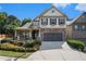 Two-story house with stone accents and landscaped front yard at 2037 Hatteras Way, Atlanta, GA 30318