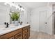 Bathroom with double vanity and modern light fixtures at 6076 Marigold Way, Atlanta, GA 30349