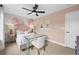 Bedroom with pink accents, glass desk, and floral wall art at 6076 Marigold Way, Atlanta, GA 30349