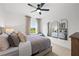 Bright bedroom with large window, ceiling fan, and ample natural light at 6076 Marigold Way, Atlanta, GA 30349