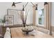 Stylish dining room features a wooden table, centerpiece, and neutral decor at 6076 Marigold Way, Atlanta, GA 30349