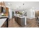 Open concept kitchen with stainless steel appliances and hardwood floors at 6076 Marigold Way, Atlanta, GA 30349