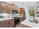 Modern kitchen with stainless steel appliances and white quartz countertops at 6076 Marigold Way, Atlanta, GA 30349