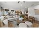 Open concept living room with sectional sofa and fireplace at 6076 Marigold Way, Atlanta, GA 30349