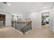 Upstairs hallway with access to bedrooms and laundry area at 6076 Marigold Way, Atlanta, GA 30349