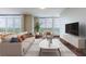 Bright living room featuring floor-to-ceiling windows and city views at 1820 Peachtree Nw St # 1507, Atlanta, GA 30309