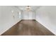 Bright Living Room with dark floors, white walls, door, and window at 1909 Meadow Ln, Decatur, GA 30032