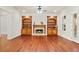 Bright living room showcasing built-in cabinets, a fireplace, and hardwood floors at 1965 Carlotta Ct, Atlanta, GA 30345