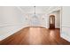 Spacious living room with hardwood floors, natural light, and decorative chandelier at 1965 Carlotta Ct, Atlanta, GA 30345