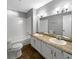 Bathroom with double sink vanity, tile flooring and shower-tub combination at 4762 Huntsman Bnd, Decatur, GA 30034