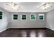 Spacious bedroom with multiple windows providing natural light and two ceiling fans at 4762 Huntsman Bnd, Decatur, GA 30034