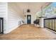 Spacious side porch with a porch swing and ceiling fan at 1738 Hosea L Williams Ne Dr, Atlanta, GA 30317