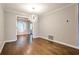 Cozy dining room with modern chandelier and hardwood floors at 38 Saint Claire Ne Ln, Atlanta, GA 30324