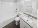 Bathroom featuring granite counters, wooden floors, and neutral walls at 6235 Marbut Farms Trl, Lithonia, GA 30058