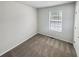 Bedroom with neutral walls and carpeted floors is bright with natural light at 6235 Marbut Farms Trl, Lithonia, GA 30058