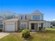 Charming home with lush front lawn, driveway, and covered porch entry at 6235 Marbut Farms Trl, Lithonia, GA 30058