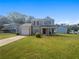 Charming two-story home with a well-maintained lawn and attached single-car garage at 6235 Marbut Farms Trl, Lithonia, GA 30058