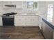 Well-lit kitchen features granite countertops, stainless steel appliances, and a modern design at 6235 Marbut Farms Trl, Lithonia, GA 30058