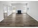 Bright and airy living room featuring a fireplace and stylish, modern flooring at 6235 Marbut Farms Trl, Lithonia, GA 30058