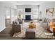 Bright living room with large windows, a cozy fireplace and neutral decor at 6235 Marbut Farms Trl, Lithonia, GA 30058