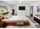 Comfortable bedroom with large windows, soft carpet, and stylish furniture at 6235 Marbut Farms Trl, Lithonia, GA 30058