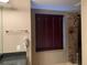Modern bathroom with a glass shower, granite counters and a window with blinds at 195 14Th Ne St # 2103, Atlanta, GA 30309