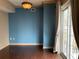 Bright bedroom with hardwood floors, large window, and custom light fixture at 195 14Th Ne St # 2103, Atlanta, GA 30309
