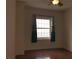 Bright bedroom featuring hardwood floors and a window with curtains at 195 14Th Ne St # 2103, Atlanta, GA 30309