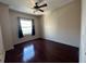 Bedroom featuring a ceiling fan, hardwood floors and a window with curtains at 195 14Th Ne St # 2103, Atlanta, GA 30309