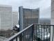 Balcony view overlooking The Starling hotel and city landscape at 195 14Th Ne St # 2103, Atlanta, GA 30309
