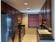 Modern kitchen featuring stainless steel appliances and dark wood cabinets at 195 14Th Ne St # 2103, Atlanta, GA 30309