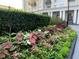 Beautifully landscaped walkway featuring lush greenery and vibrant floral arrangements enhancing curb appeal at 195 14Th Ne St # 2103, Atlanta, GA 30309