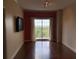 Cozy living room with hardwood floors and a sliding glass door at 195 14Th Ne St # 2103, Atlanta, GA 30309