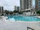 Inviting condo pool area with lounge chairs and manicured landscaping for relaxing outdoor enjoyment at 195 14Th Ne St # 2103, Atlanta, GA 30309
