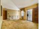 The living area features classic wallpaper and carpet with metal railing overlooking the open floor plan at 2497 Mobley Se Ct, Atlanta, GA 30315