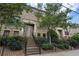 Brick townhouse with front steps, black railing, and landscaping at 37 Honour Nw Ave, Atlanta, GA 30305