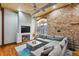 Spacious living room with exposed brick wall and hardwood floors at 330 Peters Sw St # 210, Atlanta, GA 30313