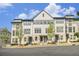 Three-story townhome community with landscaped grounds at 2673 Caruso Way, Atlanta, GA 30339