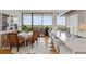 Open-concept kitchen and dining area with modern white cabinets and stainless steel appliances at 2575 Peachtree Ne Rd # 14A, Atlanta, GA 30305