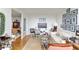 Spacious living room with eclectic decor and a seamless flow into the dining area at 2575 Peachtree Ne Rd # 14A, Atlanta, GA 30305