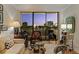 Cozy living room with large windows offering cityscape views at dusk at 2575 Peachtree Ne Rd # 14A, Atlanta, GA 30305